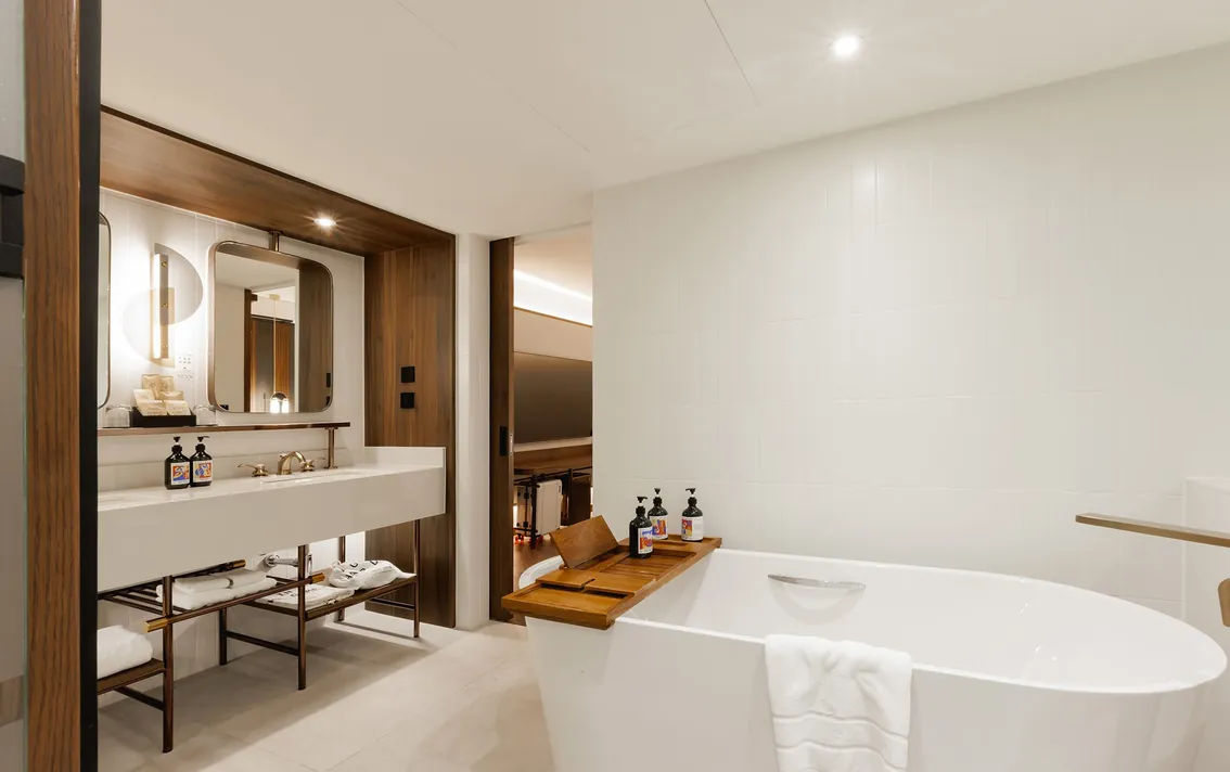 Vanity and bathtub in the One-Bedroom King Suite at Public House Bangkok