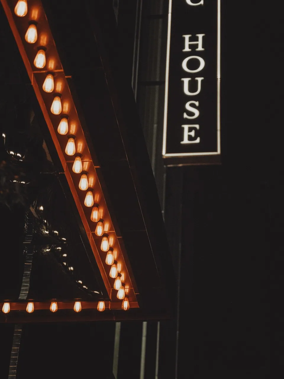 The lit marquee outside Public House Bangkok on Soi Sukhumvit 31 after dark