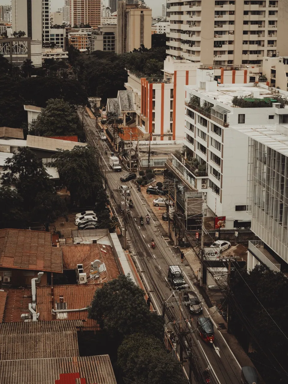 Soi Sukhumvit 31 seen from above, the street running between low-rise rooftops